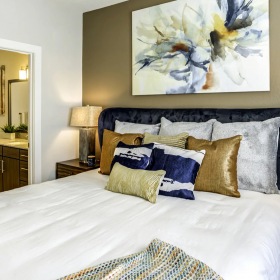 Bedroom accent wall in bedroom with bathroom access
