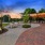 large, beer garden with stringed lighting, pergola and grills