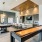 shuffle board and billiards tables in well lit resident lounge with kitchen